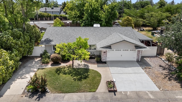 4135 Oro St, Redding, CA 96001 - view of front of home with a shingled roof, driveway, and an attached garage