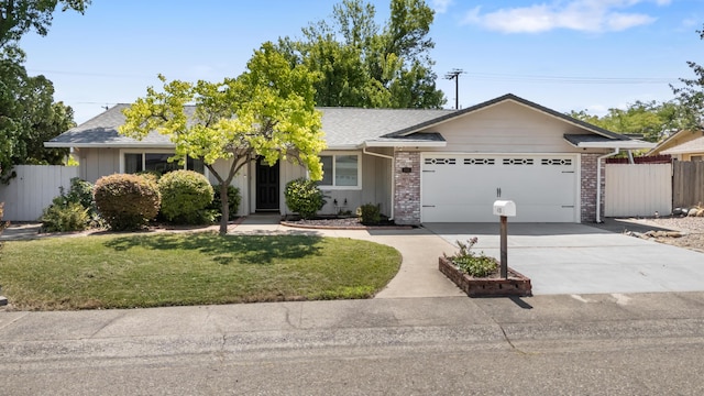 4135 Oro St, Redding, CA 96001 - ranch-style home featuring an attached garage, concrete driveway, board and batten siding, brick siding, and a shingled roof