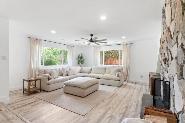 4135 Oro St, Redding, CA 96001 - living area featuring light wood finished floors, a ceiling fan, recessed lighting, and a stone fireplace