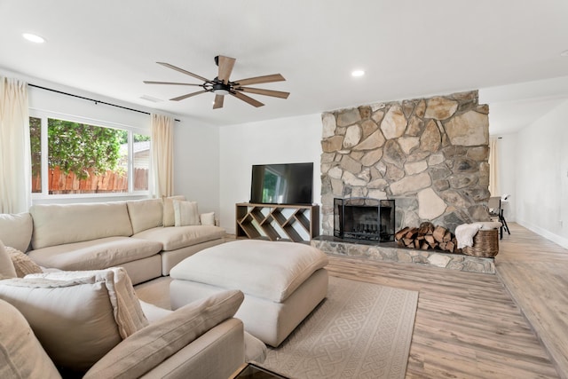 4135 Oro St, Redding, CA 96001 - living room featuring a ceiling fan, wood finished floors, a stone fireplace, and recessed lighting