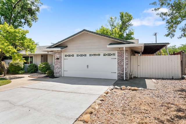 4135 Oro St, Redding, CA 96001 - ranch-style house with an attached garage, concrete driveway, and brick siding