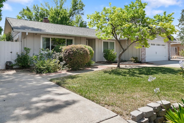 4135 Oro St, Redding, CA 96001 - single story home with board and batten siding, a garage, a chimney, and a shingled roof