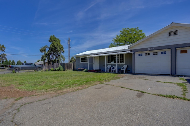 37153/55 Siskiyou St, Burney, CA 96028 - ranch-style home featuring a porch, a garage, driveway, and a metal roof