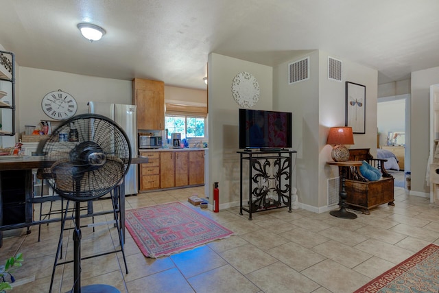 37153/55 Siskiyou St, Burney, CA 96028 - kitchen with stainless steel appliances, light tile patterned flooring, and brown cabinets