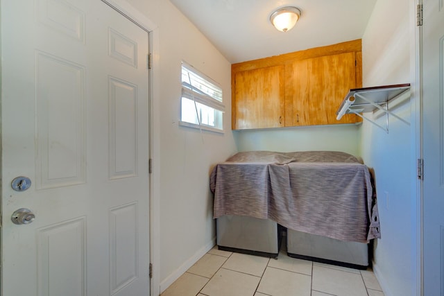 37153/55 Siskiyou St, Burney, CA 96028 - laundry room featuring baseboards and light tile patterned flooring