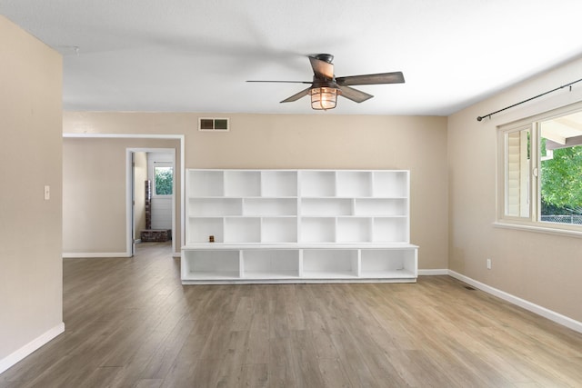 5858 Deschutes Rd, Anderson, CA 96007 - unfurnished room with a ceiling fan, plenty of natural light, and wood finished floors