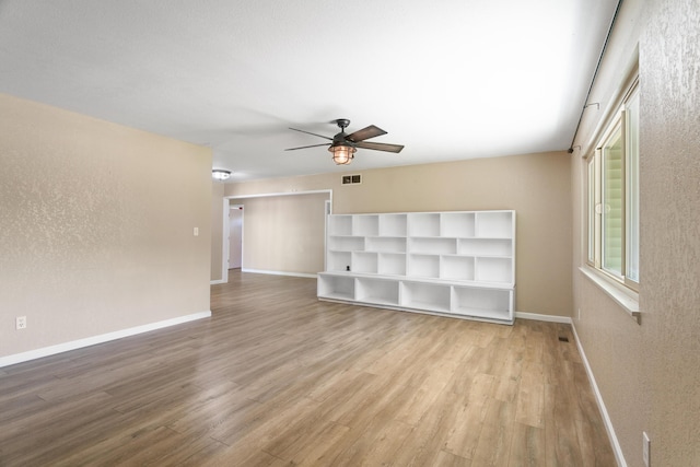 5858 Deschutes Rd, Anderson, CA 96007 - spare room featuring a ceiling fan, wood finished floors, and a textured wall