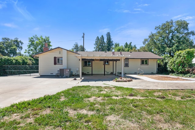 5858 Deschutes Rd, Anderson, CA 96007 - back of property featuring a chimney and a patio area
