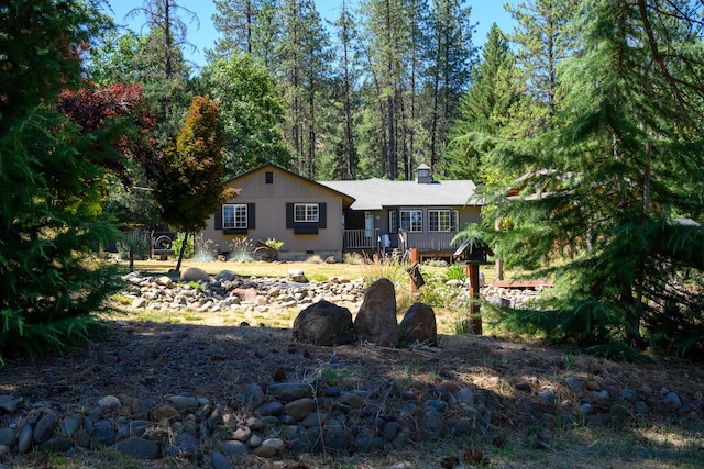 290 Mountain View Dr, Lewiston, CA 96052 - view of front facade featuring a wooden deck and a chimney