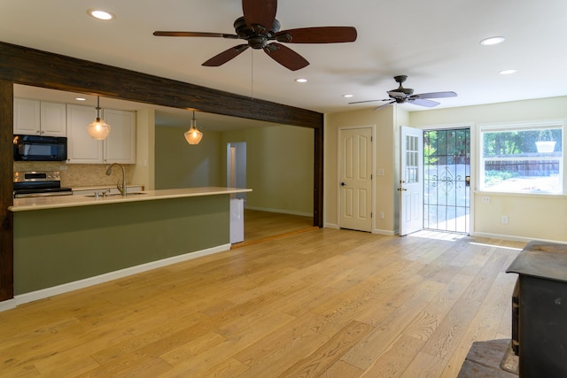 290 Mountain View Dr, Lewiston, CA 96052 - kitchen featuring black microwave, stainless steel range with electric cooktop, ceiling fan, recessed lighting, and light countertops