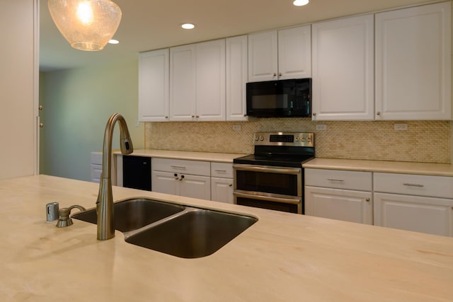 290 Mountain View Dr, Lewiston, CA 96052 - kitchen with black microwave, double oven range, light countertops, white cabinets, and recessed lighting