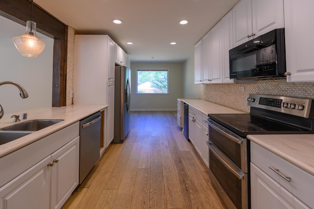 290 Mountain View Dr, Lewiston, CA 96052 - kitchen with stainless steel appliances, white cabinetry, recessed lighting, tasteful backsplash, and light wood-style flooring