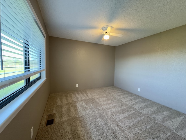 1020 Gibralter Rd, Redding, CA 96003 - spare room with carpet, a ceiling fan, and a textured ceiling