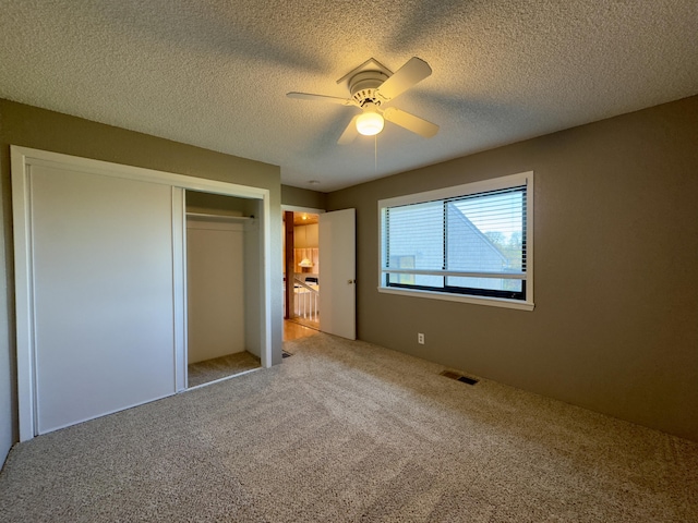 1020 Gibralter Rd, Redding, CA 96003 - unfurnished bedroom with carpet floors, a closet, a textured ceiling, and ceiling fan