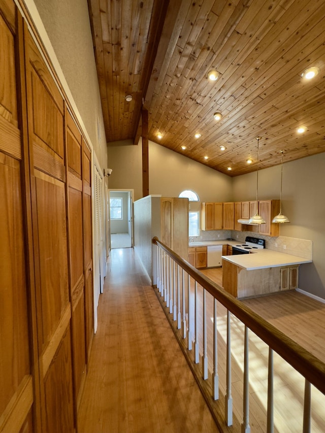 1020 Gibralter Rd, Redding, CA 96003 - kitchen featuring white appliances, wood ceiling, light countertops, a peninsula, and light wood finished floors