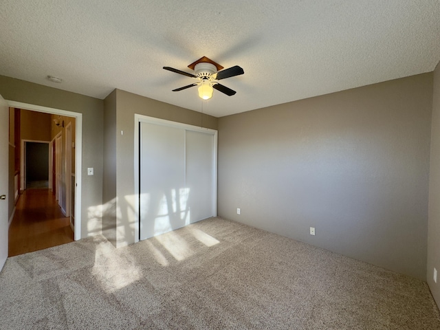 1020 Gibralter Rd, Redding, CA 96003 - unfurnished bedroom with carpet flooring, a closet, a ceiling fan, and a textured ceiling