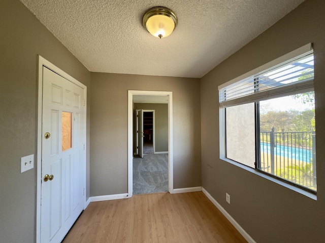 1020 Gibralter Rd, Redding, CA 96003 - spare room featuring light wood finished floors and a textured ceiling