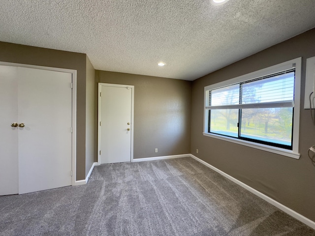 1020 Gibralter Rd, Redding, CA 96003 - unfurnished room with a textured ceiling, carpet, and recessed lighting
