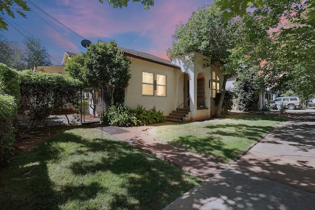 21552157 Butte St, Redding, CA 96003 - view of front of house featuring a lawn and stucco siding