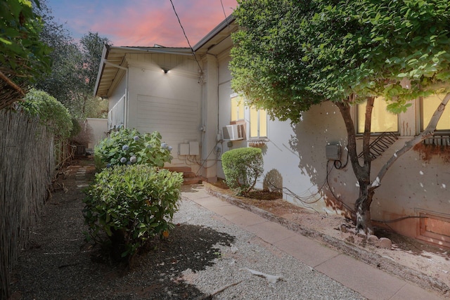 21552157 Butte St, Redding, CA 96003 - view of side of home featuring cooling unit and stucco siding