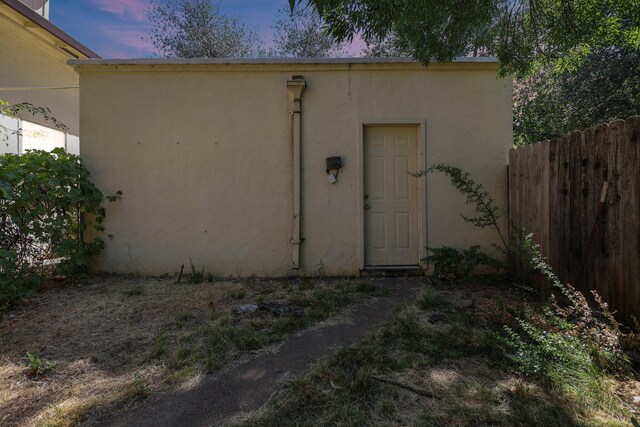 21552157 Butte St, Redding, CA 96003 - exterior entry at dusk featuring stucco siding