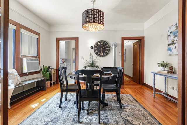21552157 Butte St, Redding, CA 96003 - dining space with a chandelier, cooling unit, and wood finished floors