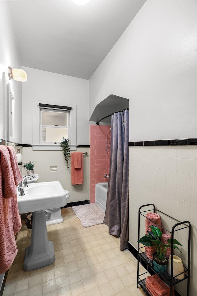 21552157 Butte St, Redding, CA 96003 - full bath with tile walls, shower / bath combo, tile patterned floors, and wainscoting