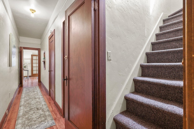 21552157 Butte St, Redding, CA 96003 - stairway with wood finished floors and a textured wall