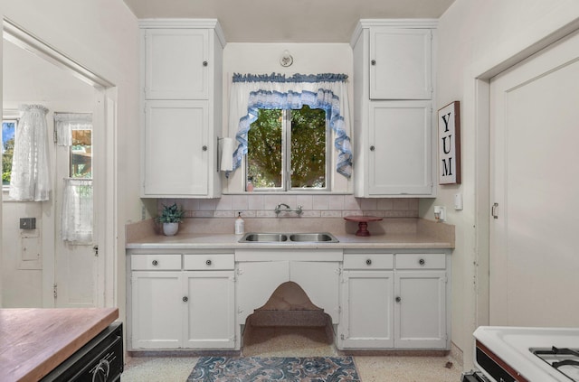 21552157 Butte St, Redding, CA 96003 - kitchen with white cabinets, light countertops, backsplash, and healthy amount of natural light