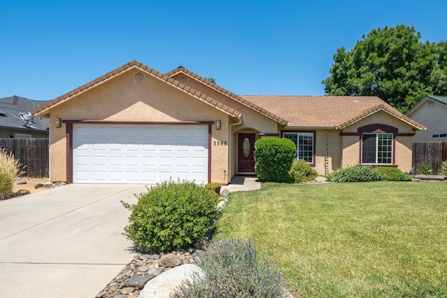 3388 Oak St, Anderson, CA 96007 - ranch-style house with stucco siding, driveway, a garage, and a tiled roof