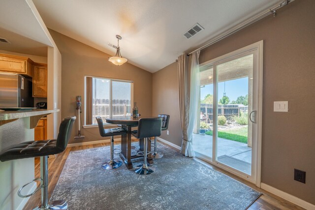 3388 Oak St, Anderson, CA 96007 - dining space featuring lofted ceiling and wood finished floors