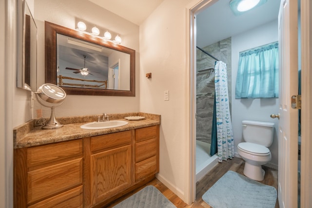 3388 Oak St, Anderson, CA 96007 - bathroom with vanity, a stall shower, wood finished floors, and a ceiling fan