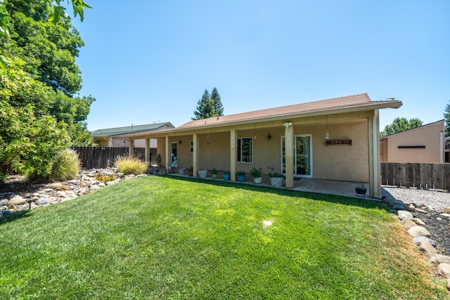 3388 Oak St, Anderson, CA 96007 - back of property featuring stucco siding and a patio area