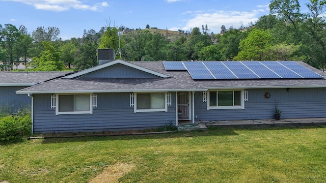13354 Kings Way, Redding, CA 96003 - ranch-style house featuring a shingled roof, solar panels, a front lawn, and a chimney