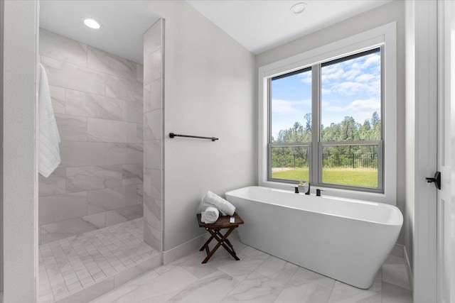 16520 Blarney Ln, Redding, CA 96001 - bathroom featuring marble look tiles, a soaking tub, walk in shower, and recessed lighting