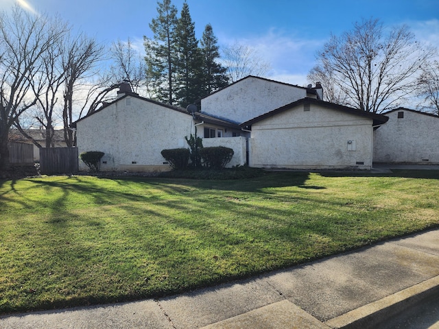897 Tanglewood Dr, Redding, CA 96003 - view of property exterior with crawl space, stucco siding, and a chimney