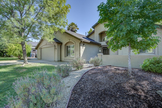 1633 Wee Burn Ct, Redding, CA 96003 - view of front of home with stucco siding, a garage, and driveway