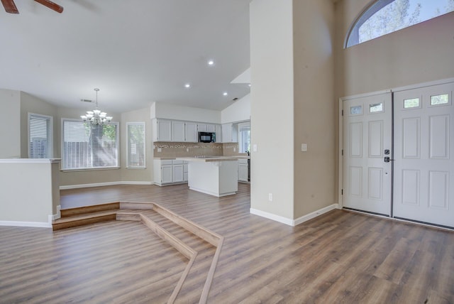 1633 Wee Burn Ct, Redding, CA 96003 - entrance foyer with a chandelier, wood finished floors, high vaulted ceiling, ceiling fan, and recessed lighting