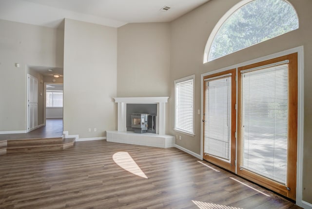 1633 Wee Burn Ct, Redding, CA 96003 - unfurnished living room featuring a high ceiling, plenty of natural light, and wood finished floors