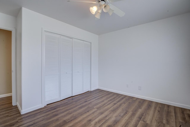 1633 Wee Burn Ct, Redding, CA 96003 - unfurnished bedroom with dark wood-type flooring, a closet, and ceiling fan