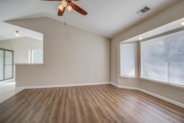 1633 Wee Burn Ct, Redding, CA 96003 - unfurnished room featuring a ceiling fan, vaulted ceiling, and wood finished floors