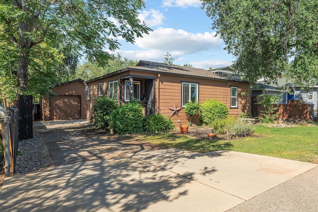 678 W St, Redding, CA 96001 - view of front of house with concrete driveway, an outdoor structure, and a garage