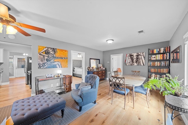 678 W St, Redding, CA 96001 - living area featuring ceiling fan and light wood finished floors