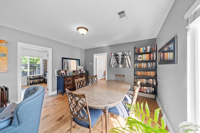678 W St, Redding, CA 96001 - dining space featuring light wood-style floors and baseboards