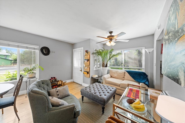 678 W St, Redding, CA 96001 - living room with healthy amount of natural light, a ceiling fan, and light wood-type flooring