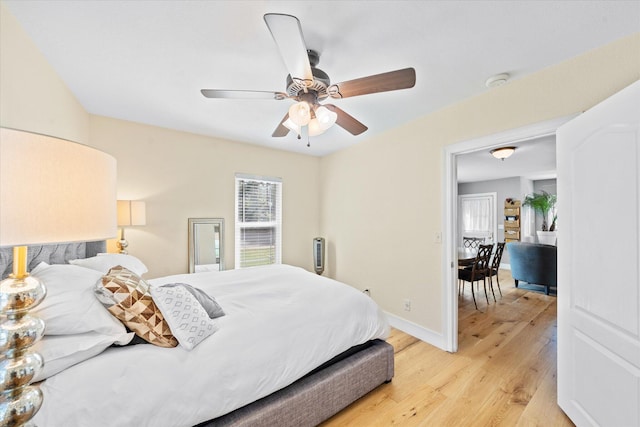 678 W St, Redding, CA 96001 - bedroom with light wood-style flooring and ceiling fan