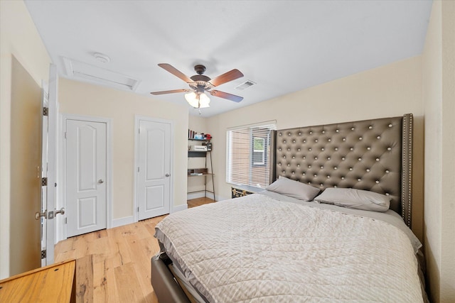 678 W St, Redding, CA 96001 - bedroom featuring attic access, light wood-type flooring, and a ceiling fan