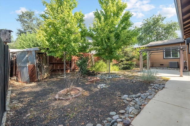 678 W St, Redding, CA 96001 - view of yard featuring a storage shed and a patio area