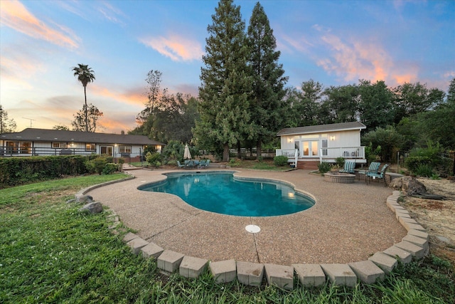19396 Natalie Way, Redding, CA 96003 - pool at dusk with a patio area, an outdoor pool, and a deck