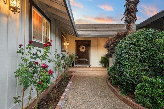 19396 Natalie Way, Redding, CA 96003 - exterior entry at dusk featuring board and batten siding
